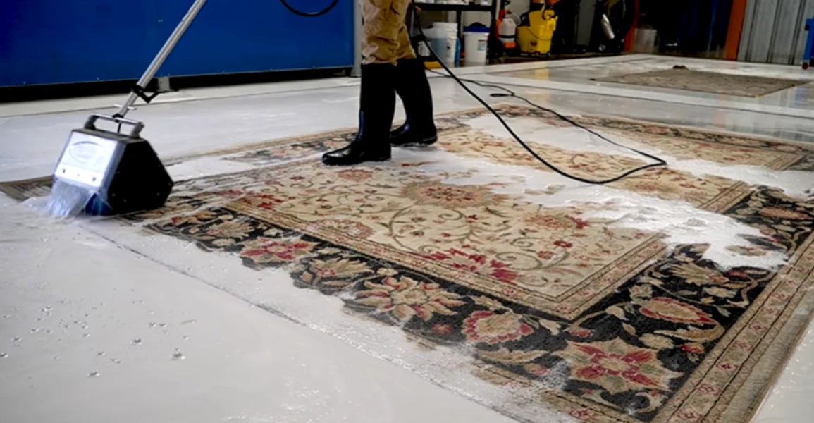 Cleaning equipment working across a large patterned area rug