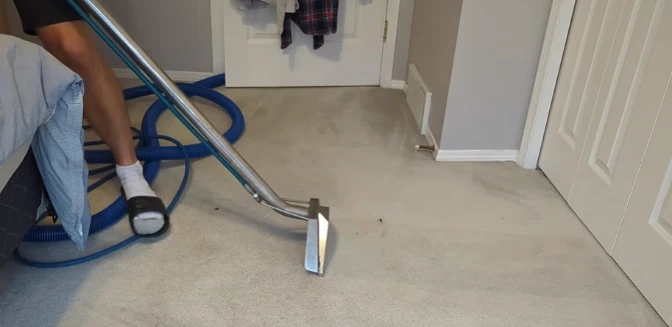 Hot water extraction carpet cleaning in a residential room