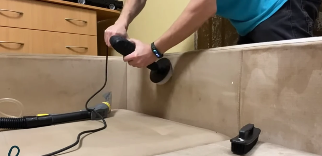 Sofa cleaning in Bismarck using a fabric-safe upholstery tool